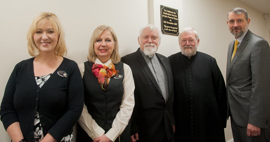 Halliwell general manager Amanda Woodward pictured at unveiling of plaque which says: “Let peace be granted to all who rest here.” With her are: funeral director Yvonne Harper, Minister Jon Magee, Father John Oakes and Halliwell deputy manager Glen Speak.